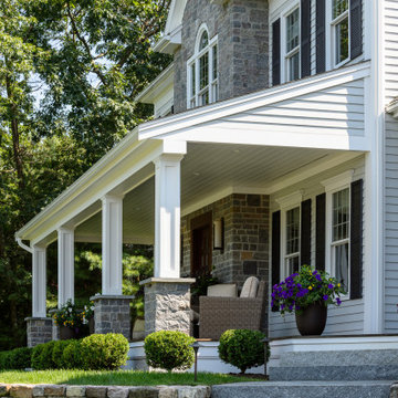 Another view of the inviting front porch with its meticulous stonework