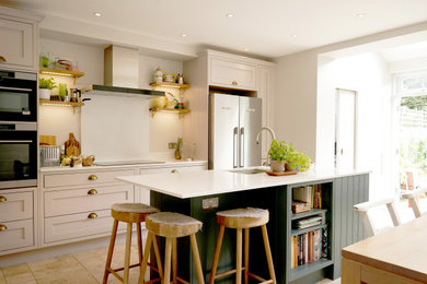 Photo of a medium sized contemporary kitchen in London with an island.