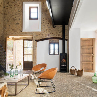 This is an example of a medium sized mediterranean formal open plan living room in Other with white walls, a wood burning stove and no tv.