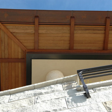 Looking up at the Custom Railing and house Eaves