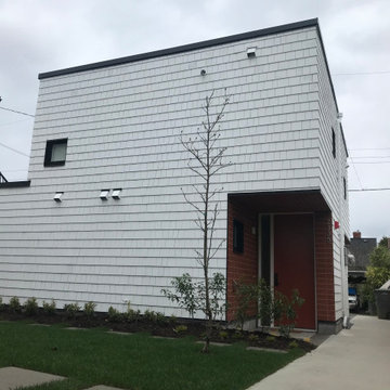 Cedar shingles over the exterior insulation