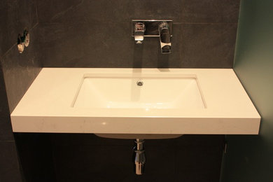 Inspiration for a small bathroom in Other with engineered quartz benchtops.