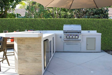 Photo of a transitional backyard patio in Orange County with an outdoor kitchen.