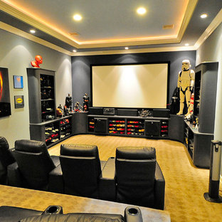 Photo of a large contemporary enclosed home cinema in Los Angeles with carpet, blue walls and beige floors.