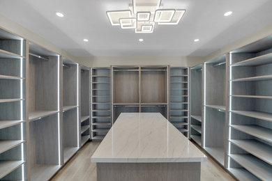 Example of a large trendy closet design in Miami