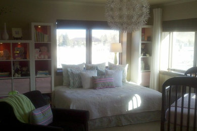 Nursery - mid-sized transitional girl carpeted nursery idea in Other with beige walls