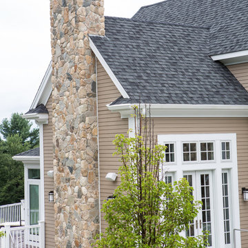 New England Style Design: Fireplace, Chimney, Columns, and Stone Siding