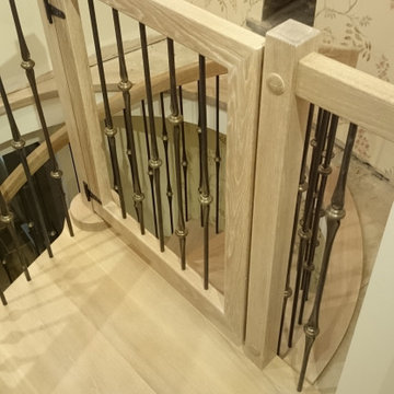 Limed Oak Spiral Staircase with matching stair gate