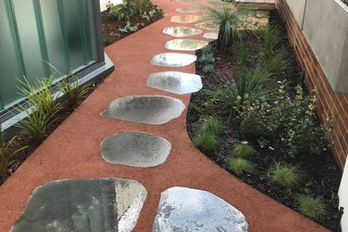 This is an example of a small contemporary courtyard xeriscape in Perth.