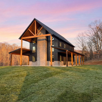 Modern Barn Style New Home Build with Wraparound Porch and Timber Beams