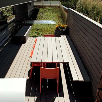 Built-in-bench and custom table connect to deck and privacy wall.