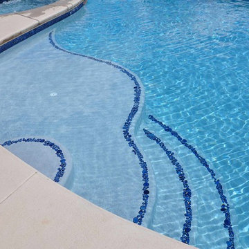 Mountain Lake style salt water in ground pool with Raised Spa