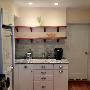 Small contemporary kitchen pantry ideas - Example of a small trendy galley light wood floor kitchen pantry design in Burlington with an undermount sink, beaded inset cabinets, white cabinets, marble countertops, gray backsplash, ceramic backsplash and stainless steel appliances