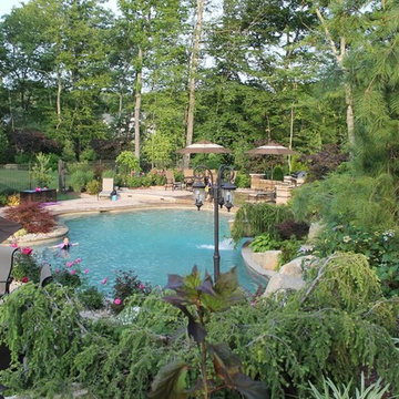 Construction process for pool with slide, water features and landscape