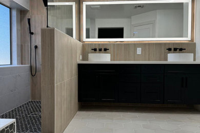 Example of a mid-sized minimalist master double-sink bathroom design in Phoenix with black cabinets, white countertops and a built-in vanity