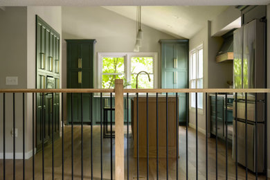 Inspiration for a mid-sized timeless u-shaped light wood floor and beige floor eat-in kitchen remodel in Minneapolis with an undermount sink, shaker cabinets, green cabinets, quartz countertops, white backsplash, quartz backsplash, stainless steel appliances, an island and white countertops
