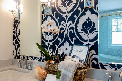 Example of a transitional master white tile marble floor bathroom design in Jacksonville with shaker cabinets, white cabinets, white walls, an undermount sink and marble countertops