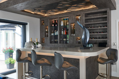 Design ideas for a contemporary home bar in Cheshire.