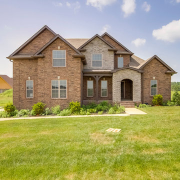 Brick and Stone Two Story with Neighborhood Amenities