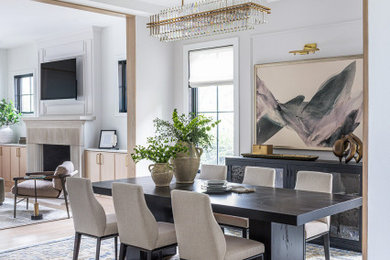 Inspiration for a transitional light wood floor and beige floor dining room remodel in Chicago with white walls
