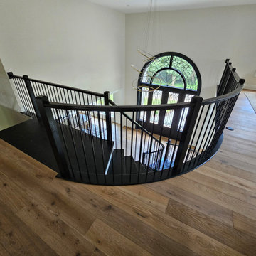 Project #130 | Curved Staircase with Wraparound Balcony