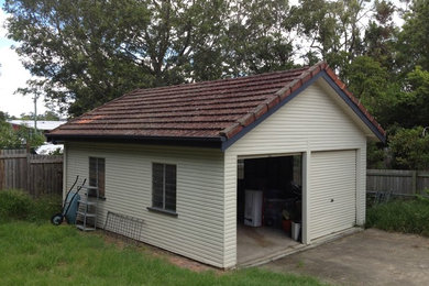 This is an example of a mid-sized traditional detached two-car garage in Brisbane.