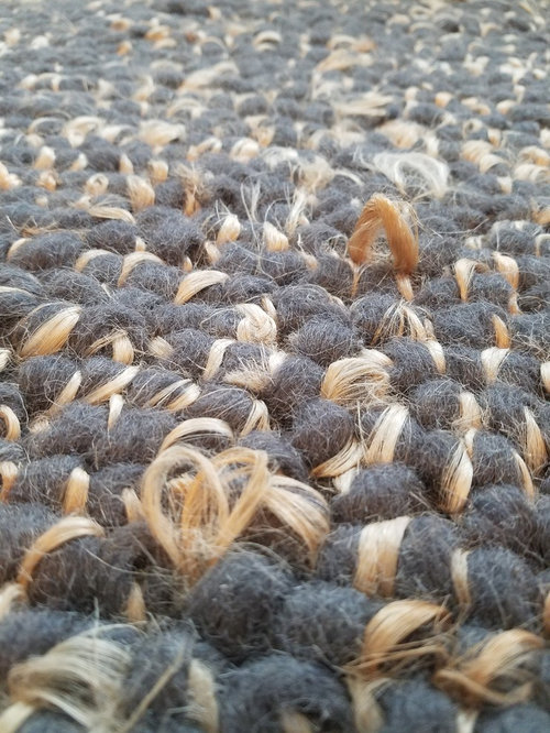 Wool rug normal or damaged?
