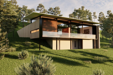 Imagen de fachada de casa moderna pequeña de dos plantas con revestimientos combinados