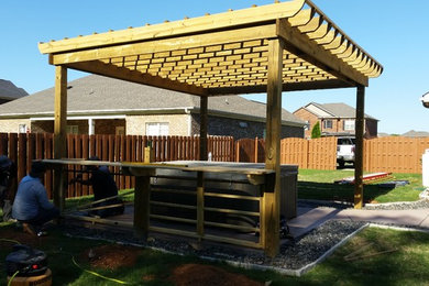 Patio - mid-sized rustic backyard decomposed granite patio idea in Other with a pergola