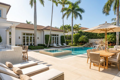 Island style pool photo in Miami