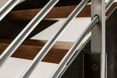 Staircase - contemporary metal railing staircase idea in Seattle