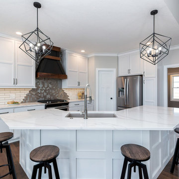 McCoy Homes Quad Cities Kitchen With White Cabinets and Matte Black Accents