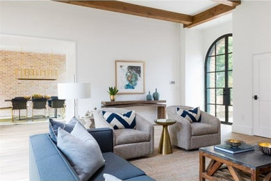Large traditional living room in Austin with medium hardwood flooring and beige floors.