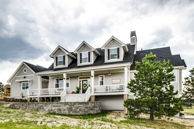 Inspiration for a mid-sized farmhouse beige one-story wood exterior home remodel in Denver with a shingle roof