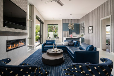 Living room - mid-sized transitional enclosed porcelain tile, gray floor and wallpaper living room idea in Phoenix with blue walls, a ribbon fireplace and a tile fireplace