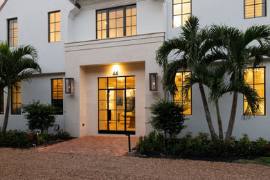 Example of a french country exterior home design in Miami
