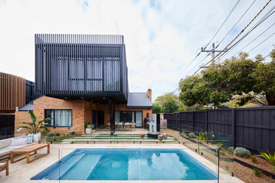 Photo of a mid-sized front yard rectangular pool in Melbourne.