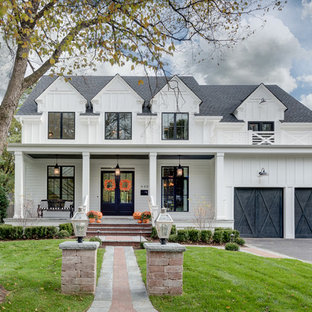 Inspiration for a large farmhouse white two-story wood house exterior remodel in Chicago with a shingle roof
