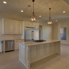 Cream kitchen with adjacent dark floor