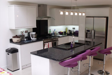 Photo of a modern kitchen in West Midlands with an island.