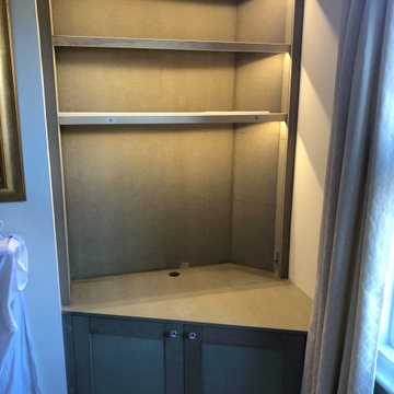 Fitted bookcase and cabinet with integrated lighting