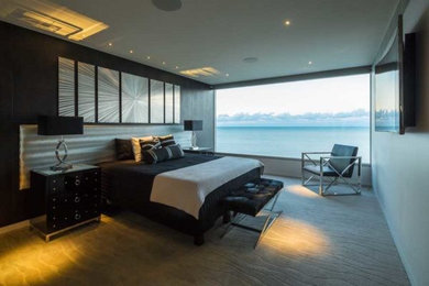 Inspiration for a large contemporary bedroom in Cairns with white walls and carpet.