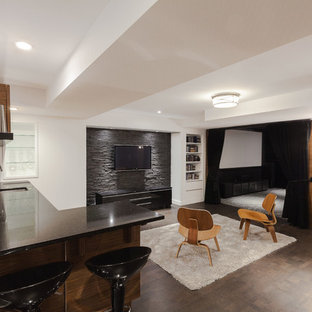 Medium sized modern fully buried basement in Ottawa with white walls, cork flooring and a standard fireplace.