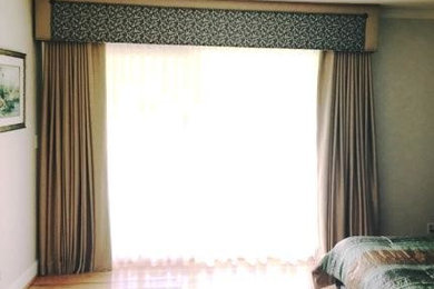 Example of a large classic master bedroom design in Other