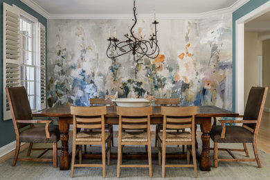 Example of a mid-sized eclectic light wood floor and brown floor enclosed dining room design in Philadelphia with blue walls
