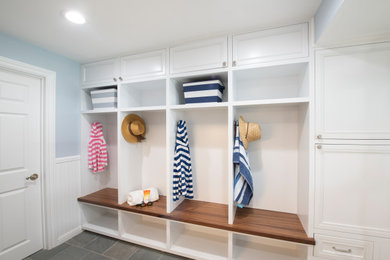 Inspiration for a mid-sized transitional walk-out gray floor and wainscoting basement remodel in San Francisco with blue walls