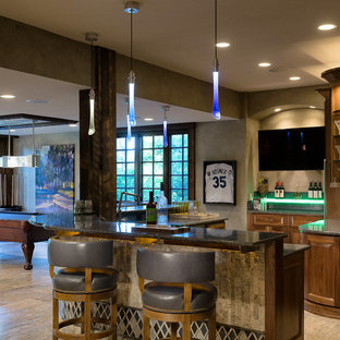 Inspiration for an expansive classic look-out basement in Kansas City with beige walls, travertine flooring and a standard fireplace.