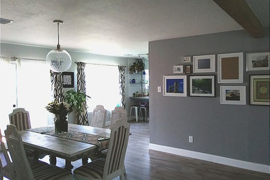 Kitchen/dining room combo - mid-sized farmhouse laminate floor and gray floor kitchen/dining room combo idea in Houston with gray walls and no fireplace