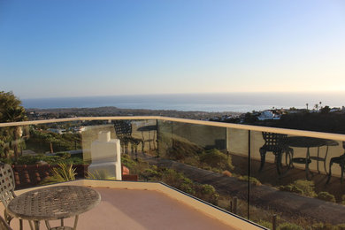 Deck - small mediterranean backyard deck idea in Orange County with no cover