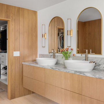 Wood panel vanity, arch mirrors — 90s Fixer, Reno interior design by Find Design